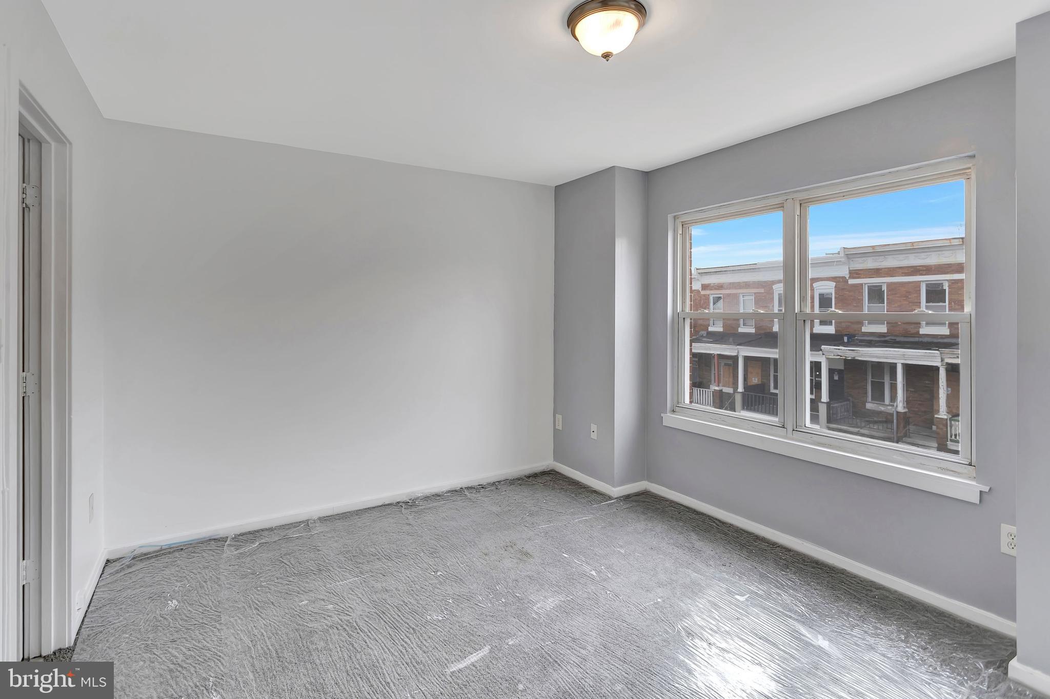 2347 McCulloh Street Baltimore, MD 21217 - Photo 13 of 28 a view of an empty room with a window