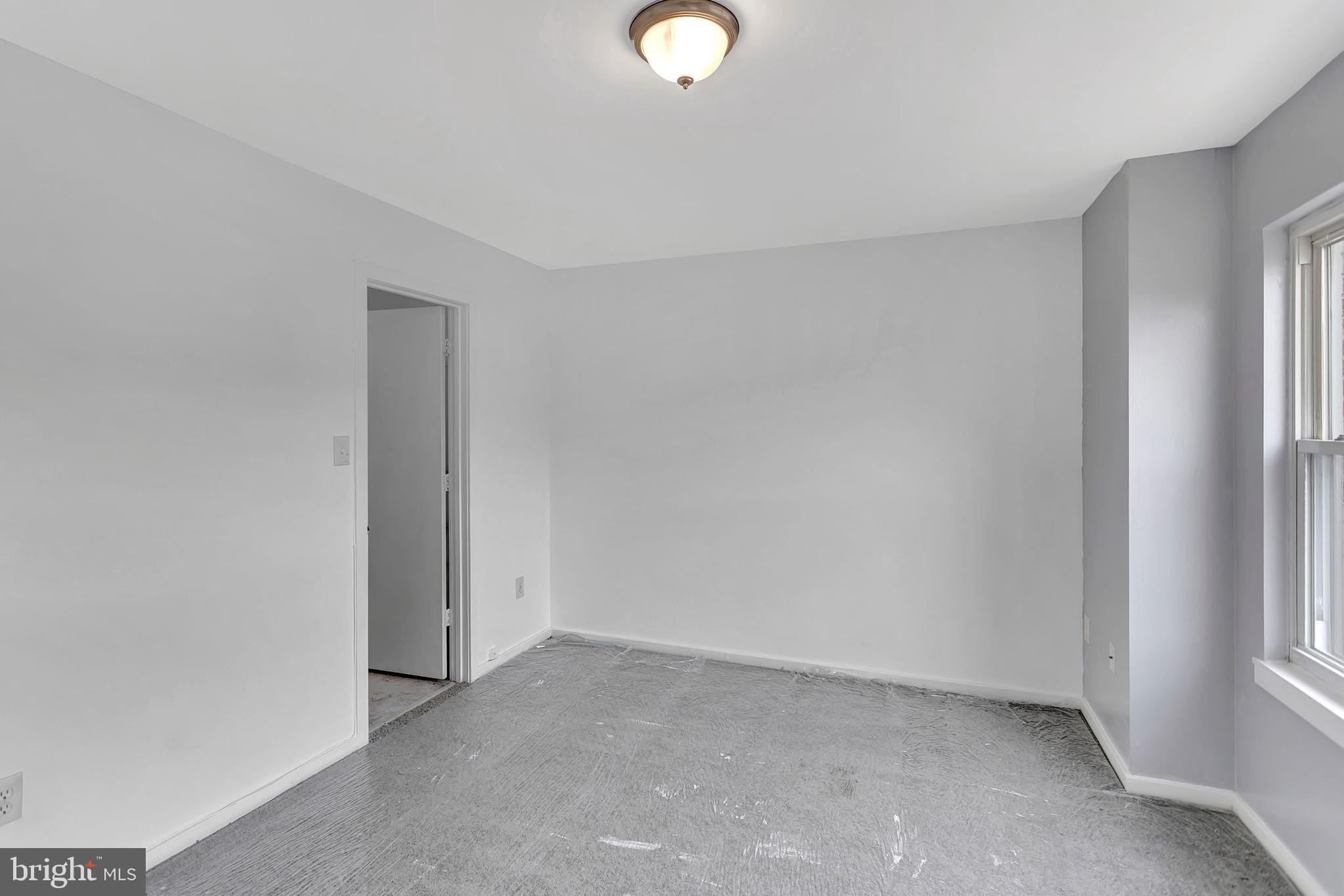 2347 McCulloh Street Baltimore, MD 21217 - Photo 14 of 28 a view of an empty room with a window