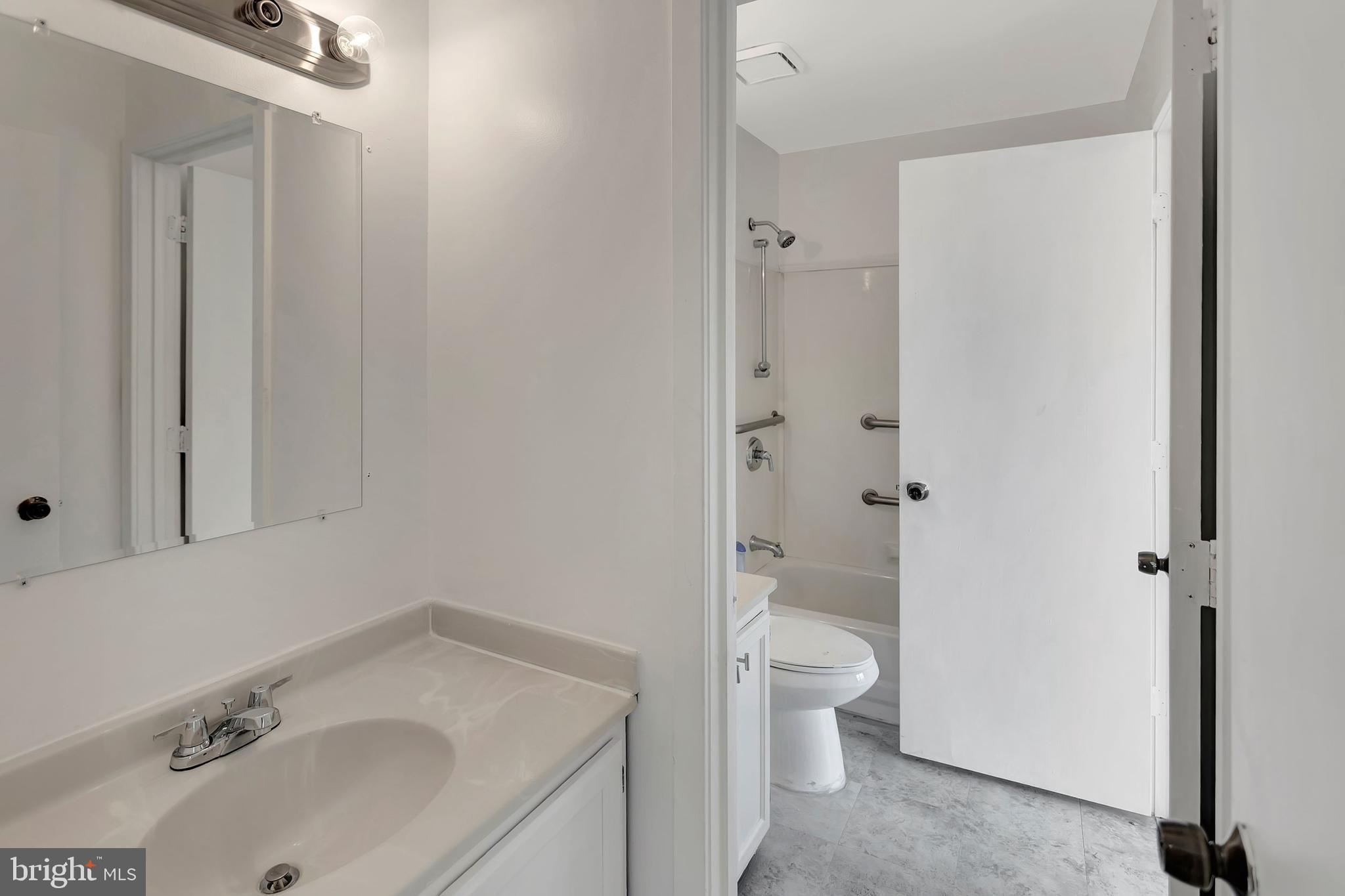 2347 McCulloh Street Baltimore, MD 21217 - Photo 17 of 28 a bathroom with a sink toilet and shower