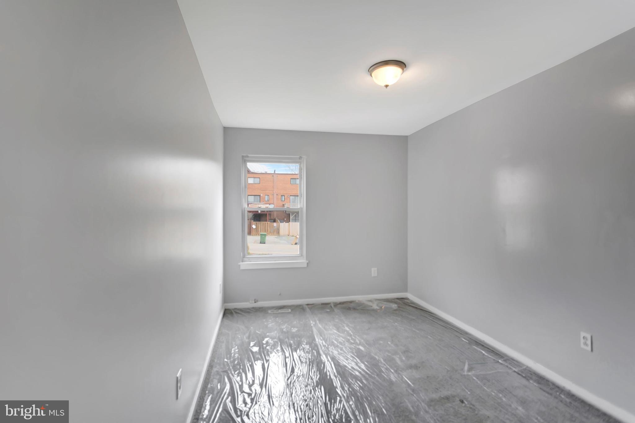 2347 McCulloh Street Baltimore, MD 21217 - Photo 21 of 28 an empty room with a window