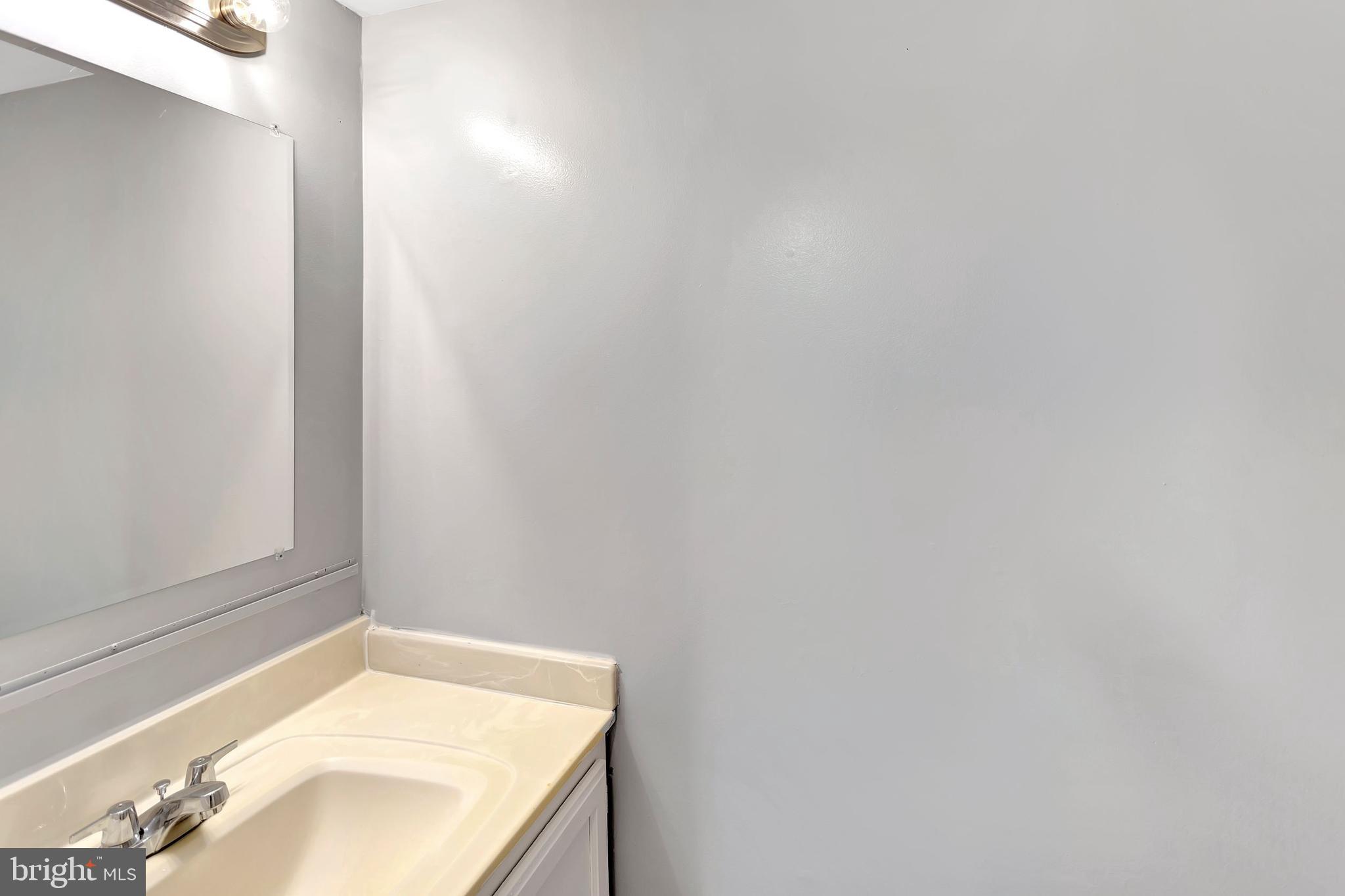 2347 McCulloh Street Baltimore, MD 21217 - Photo 5 of 28 a bathroom with a granite countertop sink and vanity