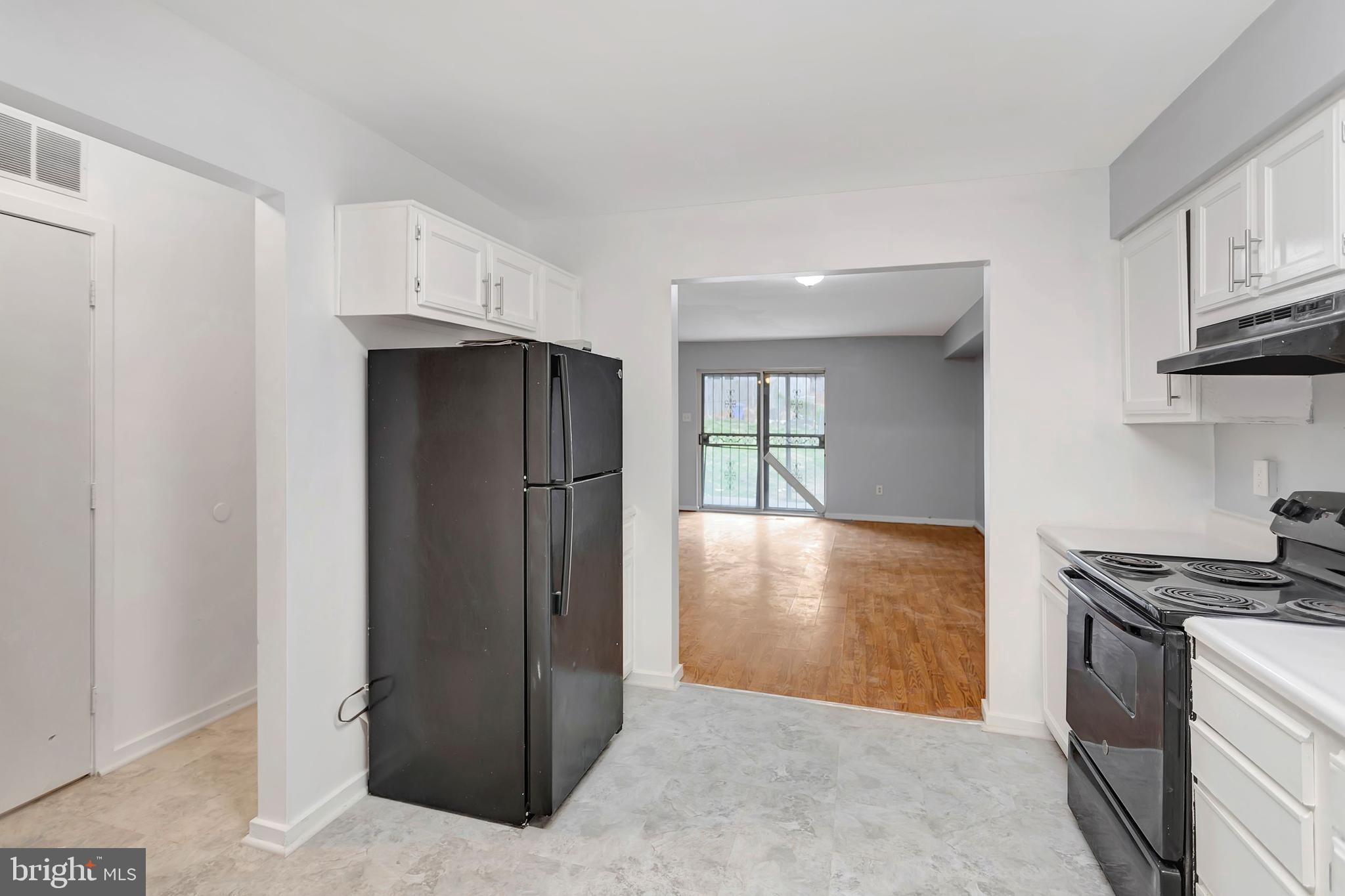 2347 McCulloh Street Baltimore, MD 21217 - Photo 7 of 28 a kitchen with stainless steel appliances granite countertop a refrigerator and a stove top oven