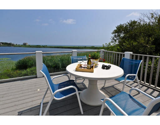 a view of a chairs and table in the patio