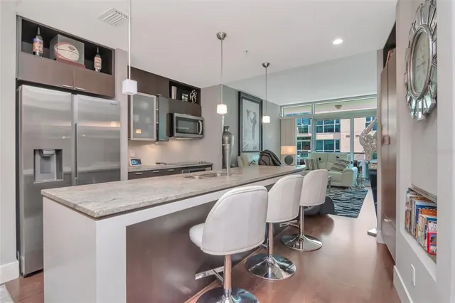 a very nice looking dining room with a large window