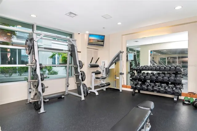 a view of room with window and wooden floor