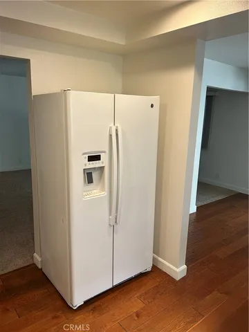 a white refrigerator freezer sitting in a kitchen