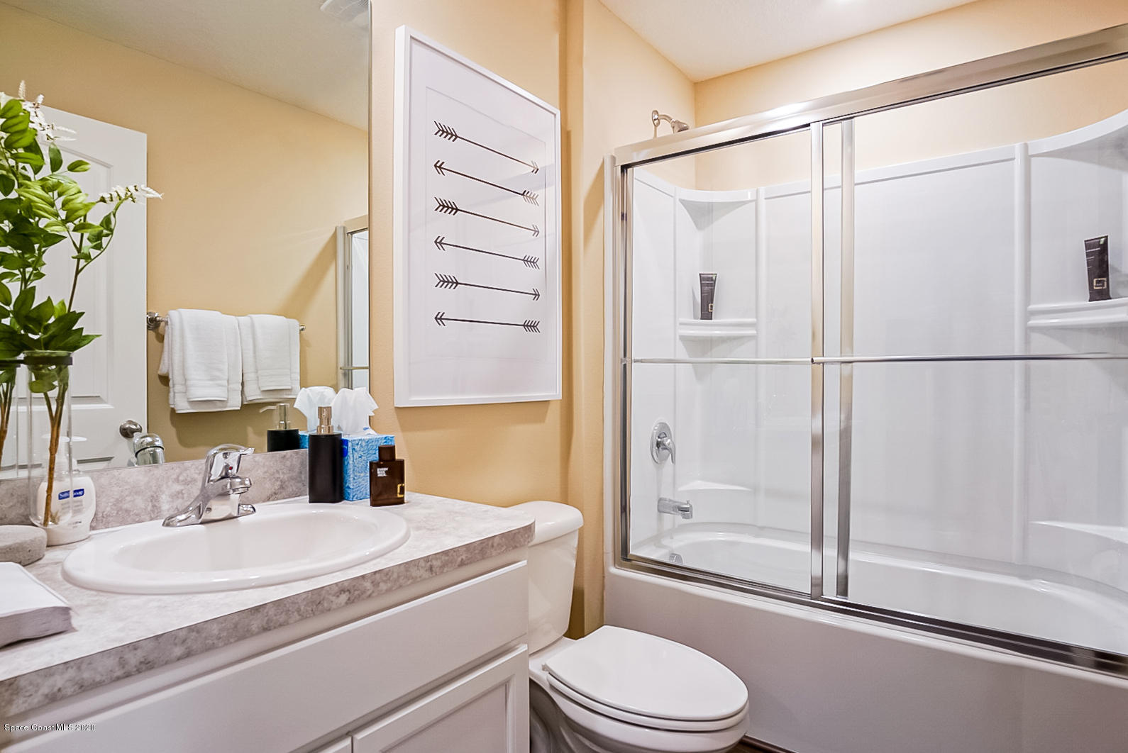 261 Abalone Road Northwest Palm Bay, FL 32907 - Photo 13 of 18 a bathroom with a sink a toilet and shower