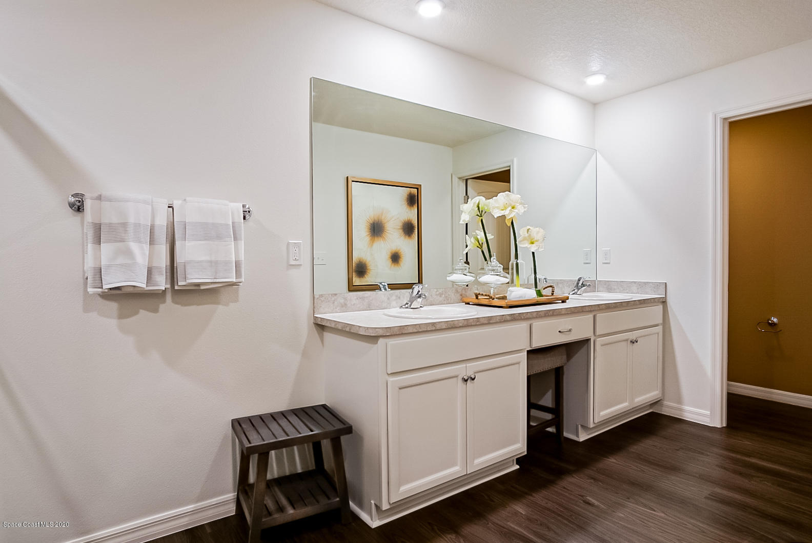 261 Abalone Road Northwest Palm Bay, FL 32907 - Photo 16 of 18 a bathroom with a sink and a mirror