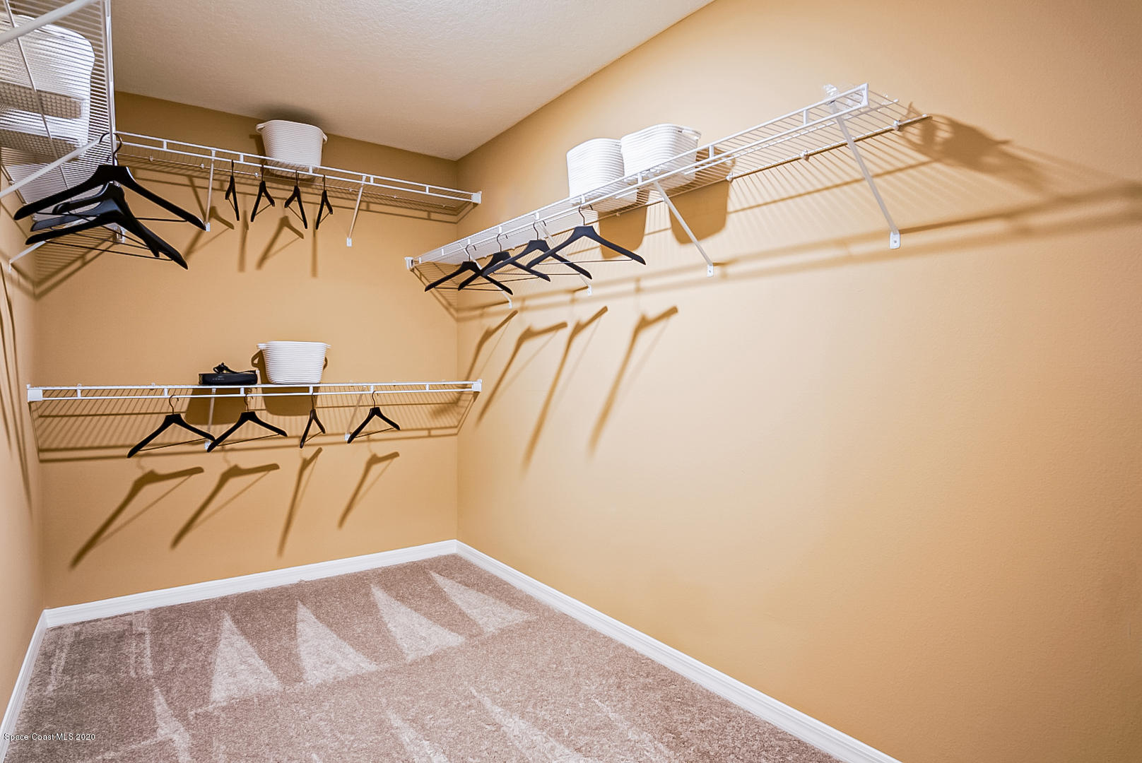 261 Abalone Road Northwest Palm Bay, FL 32907 - Photo 18 of 18 a view of a room with racks on the wall