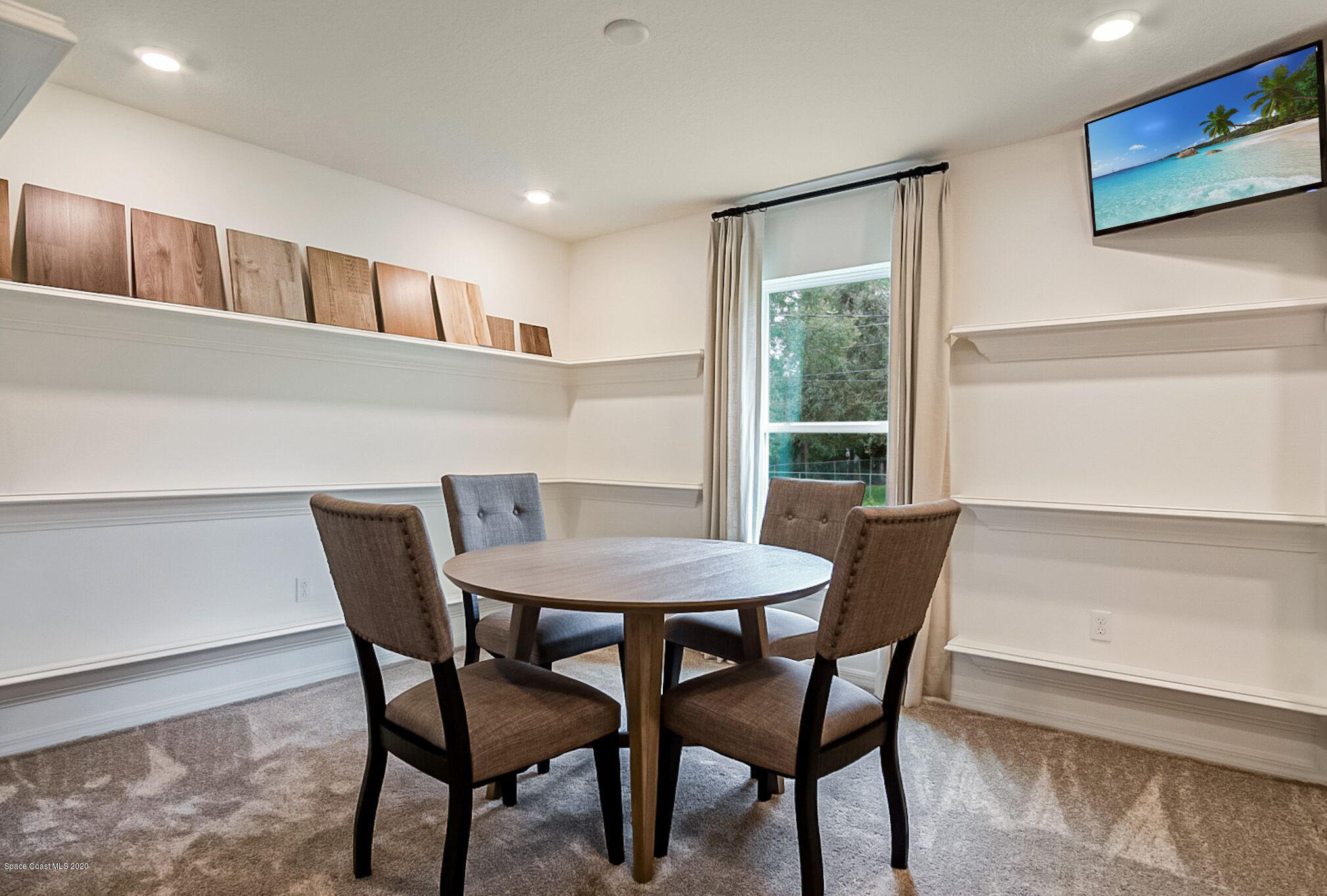 261 Abalone Road Northwest Palm Bay, FL 32907 - Photo 5 of 18 a view of a dining room with furniture and a window