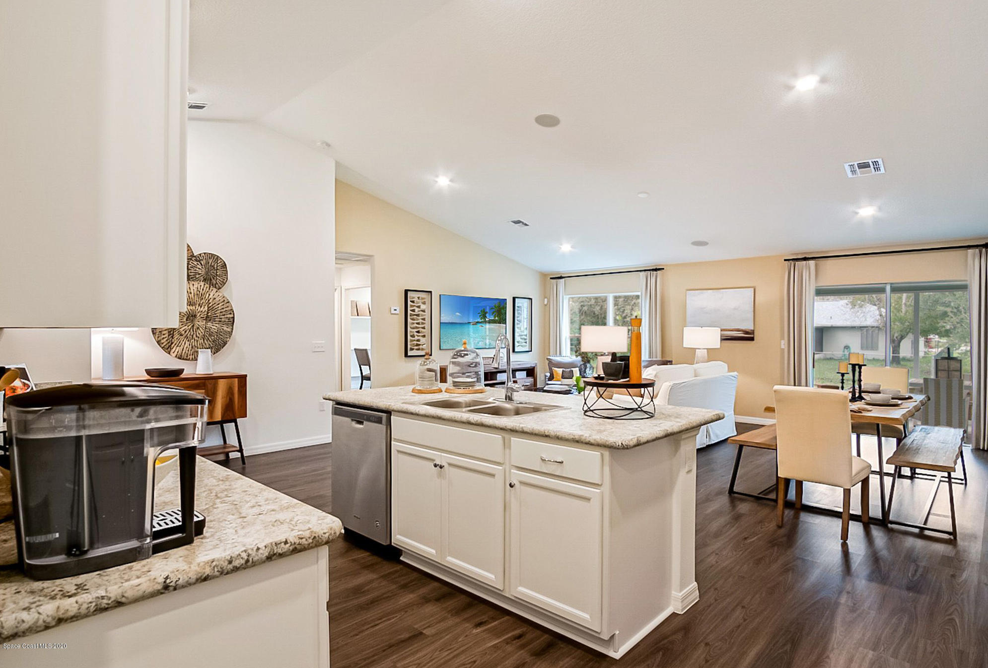 261 Abalone Road Northwest Palm Bay, FL 32907 - Photo 7 of 18 a kitchen with a sink and stove
