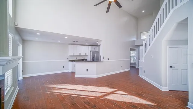 a view of kitchen with refrigerator and window
