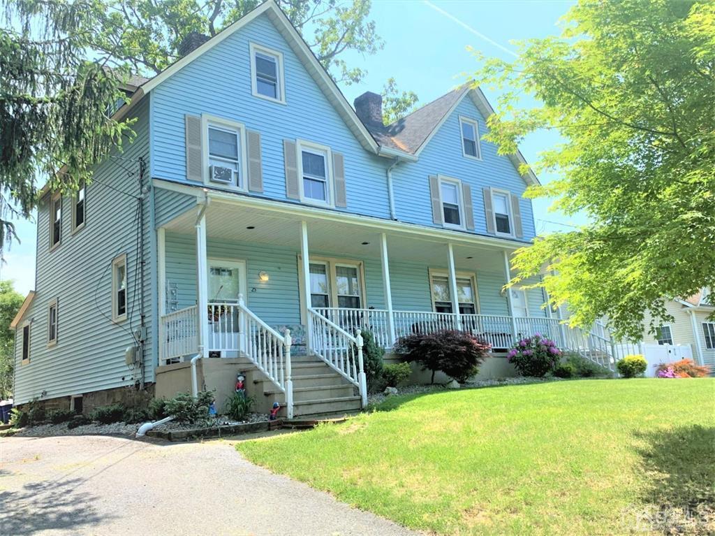 23 Maple Street Helmetta, NJ 08828 - Photo 2 of 6 a front view of a house with garden