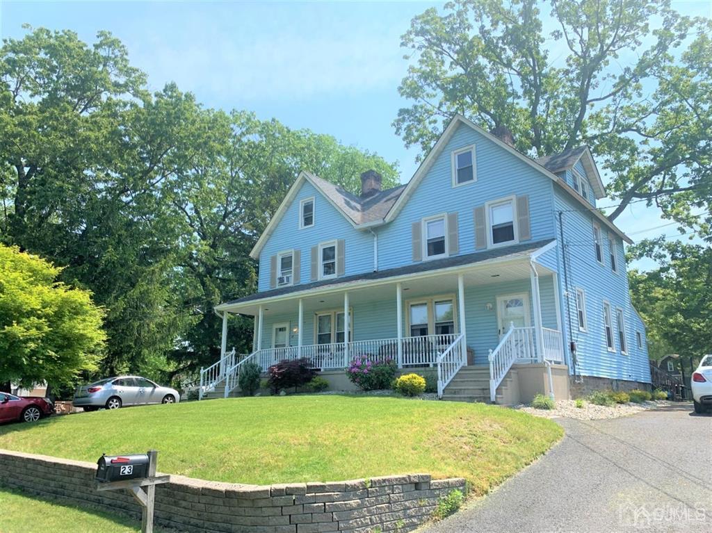 23 Maple Street Helmetta, NJ 08828 - Photo 3 of 6 a front view of a house with garden