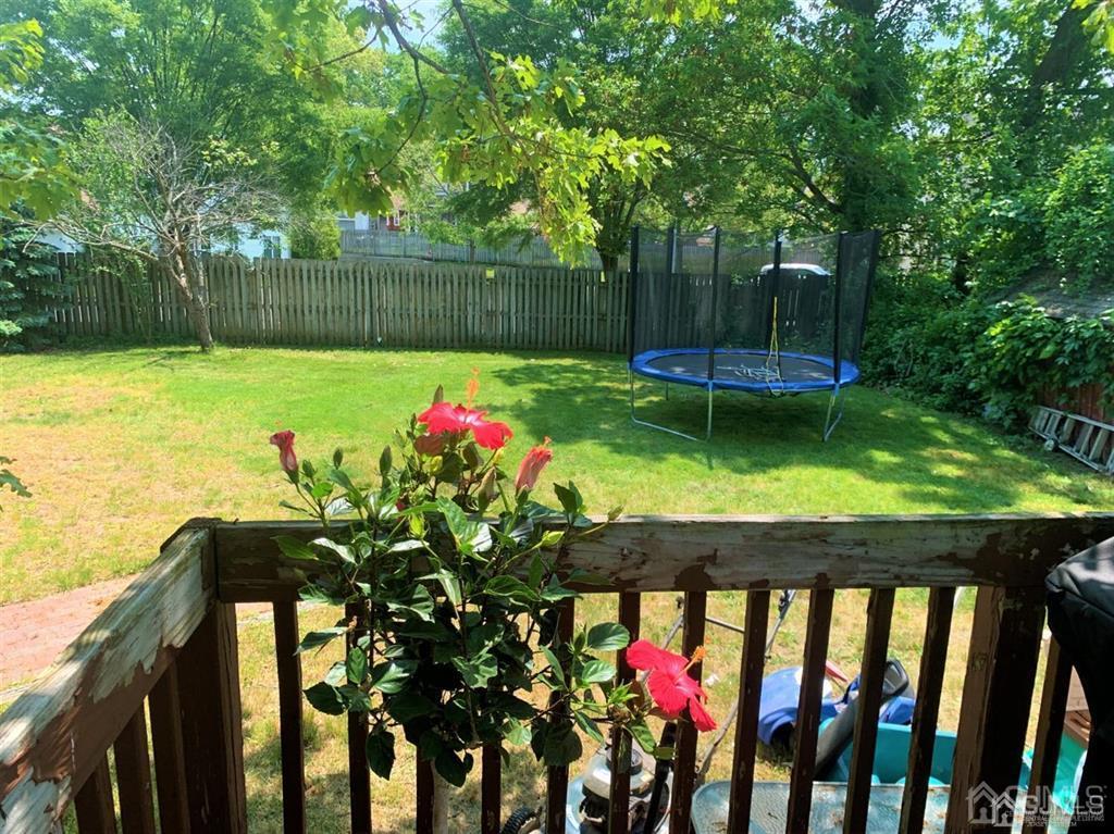 23 Maple Street Helmetta, NJ 08828 - Photo 4 of 6 a view of yard with swimming pool and green space