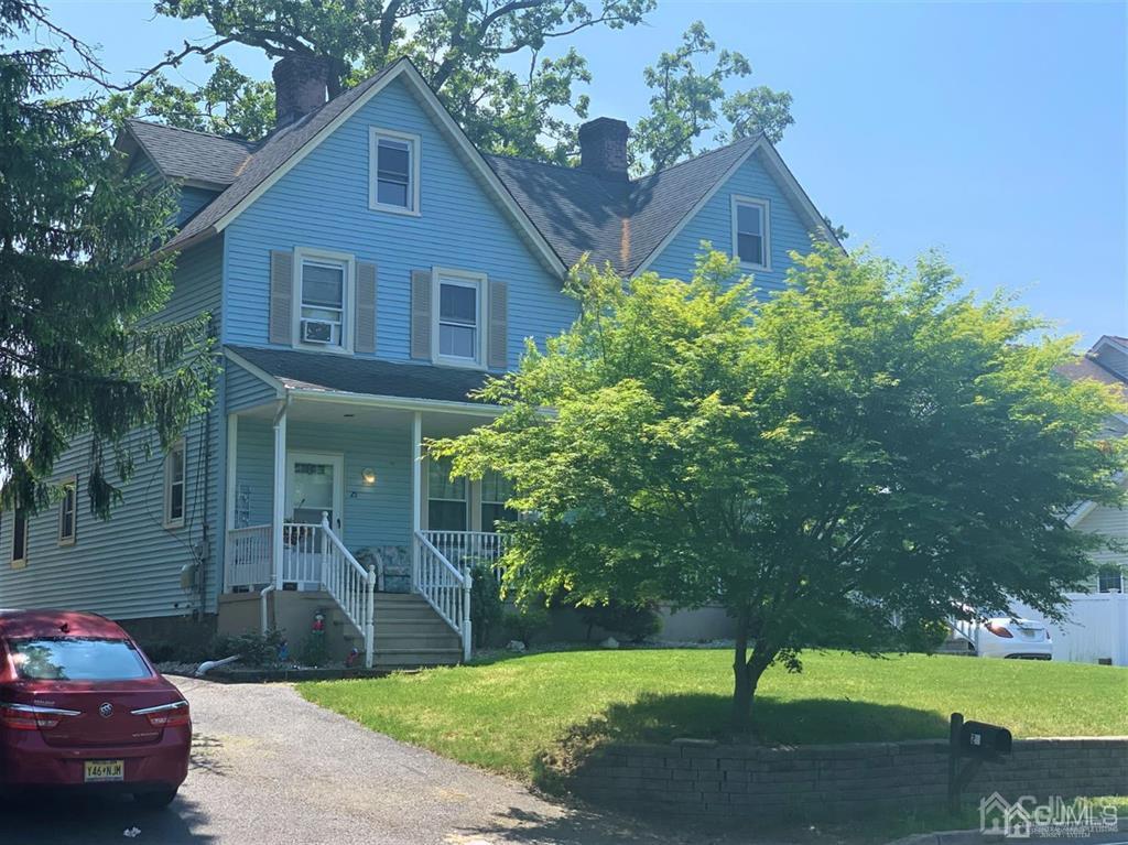 23 Maple Street Helmetta, NJ 08828 - Photo 5 of 6 a front view of a house with a garden and trees