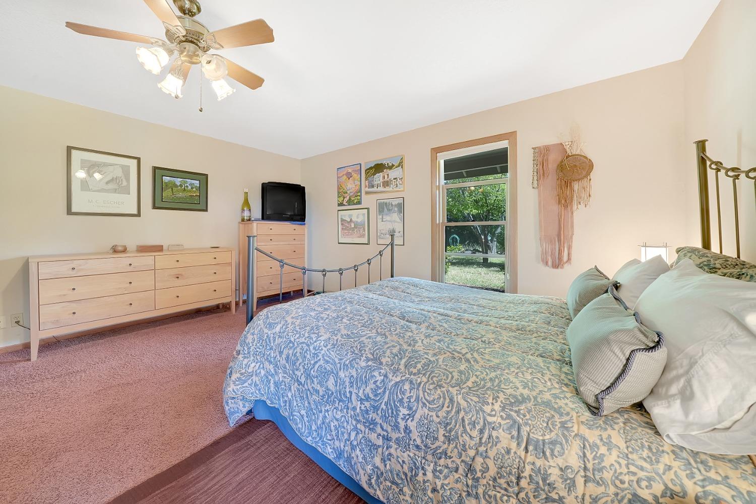 16915 Red Mule Road Fiddletown, CA 95629 - Photo 22 of 66 a bedroom with a bed and a dresser