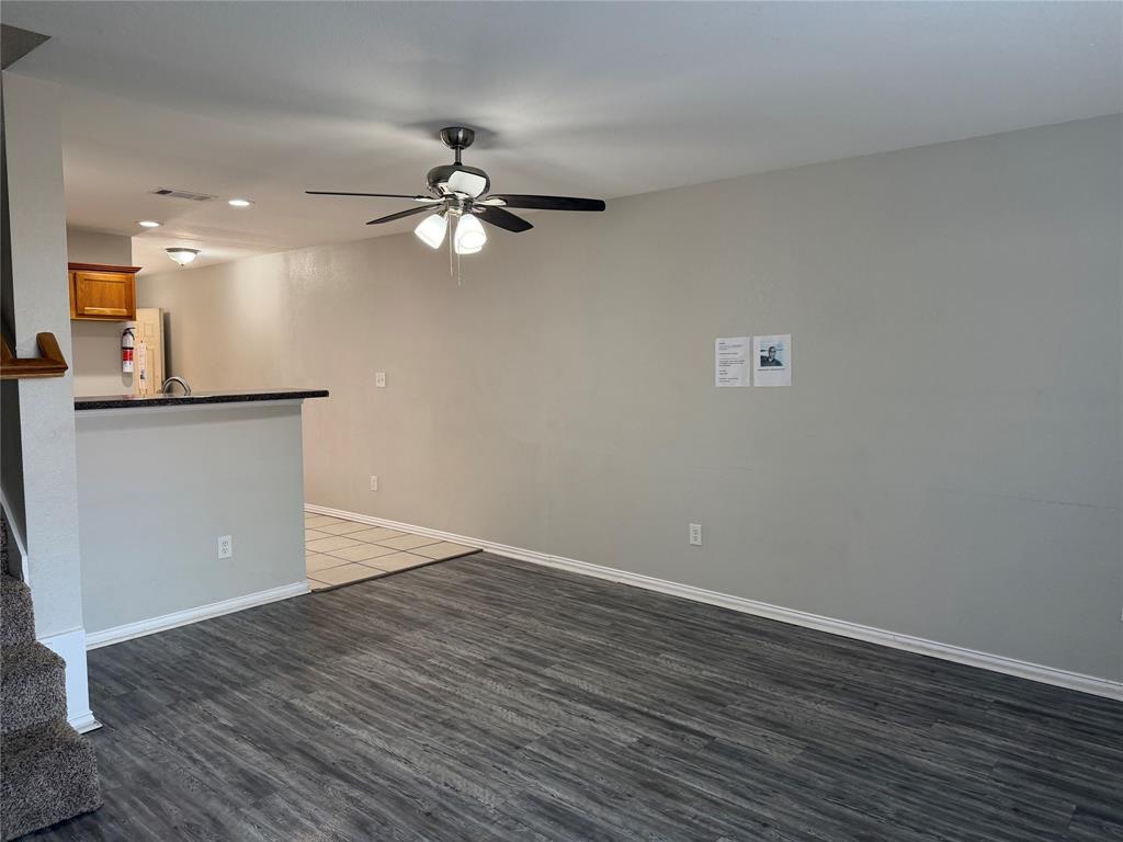 4005 Preferred Place Dallas, TX 75237 - Photo 13 of 31 a view of a room with wooden floor and a ceiling fan