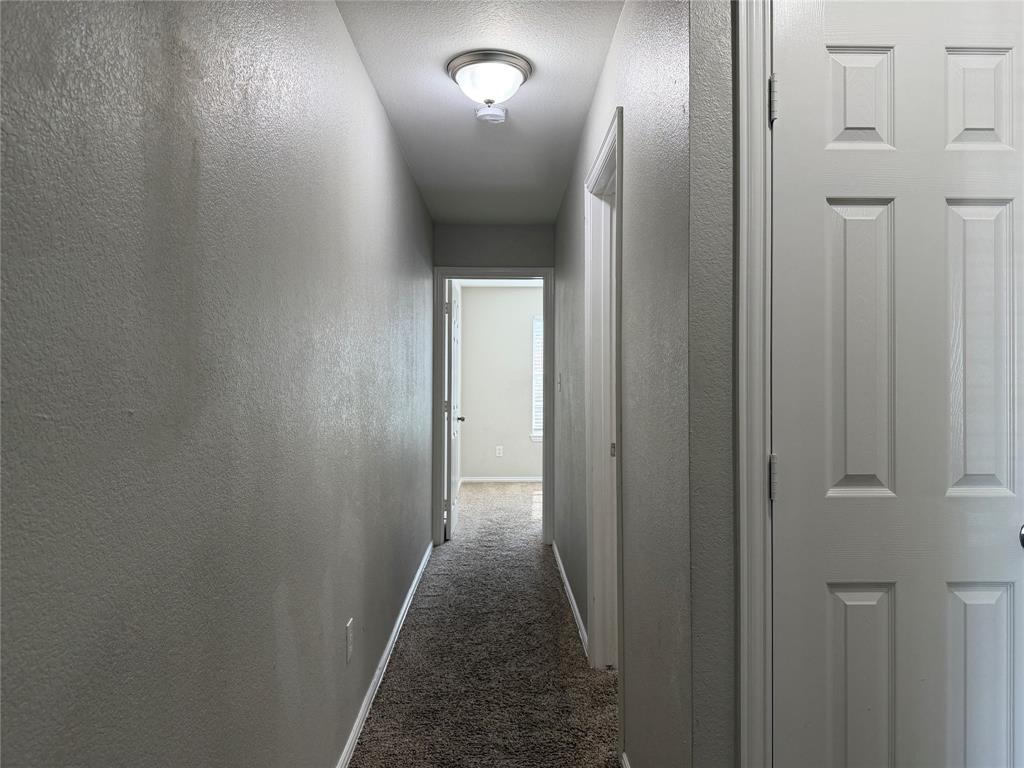 4005 Preferred Place Dallas, TX 75237 - Photo 15 of 31 a view of a hallway with wooden floor