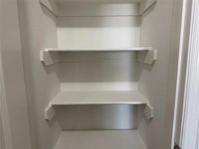 a white bath tub sitting next to a white toilet