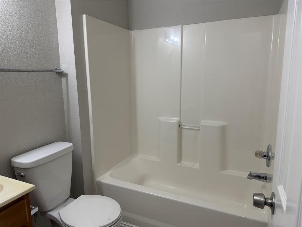 4005 Preferred Place Dallas, TX 75237 - Photo 20 of 31 a white toilet sitting next to a bath tub