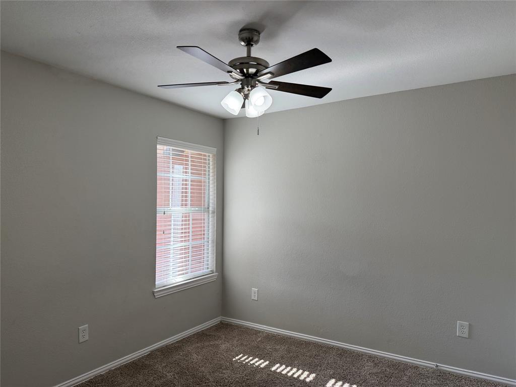 4005 Preferred Place Dallas, TX 75237 - Photo 26 of 31 an empty room with windows and fan