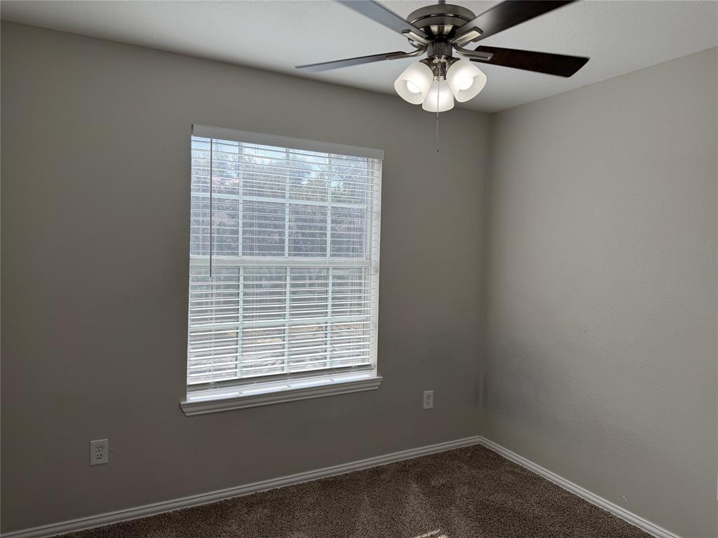 4005 Preferred Place Dallas, TX 75237 - Photo 28 of 31 an empty room with a window and a fan