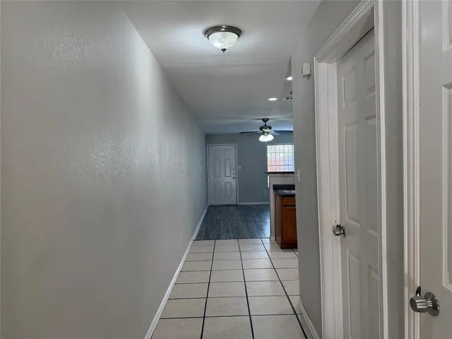 wooden floor with a kitchen