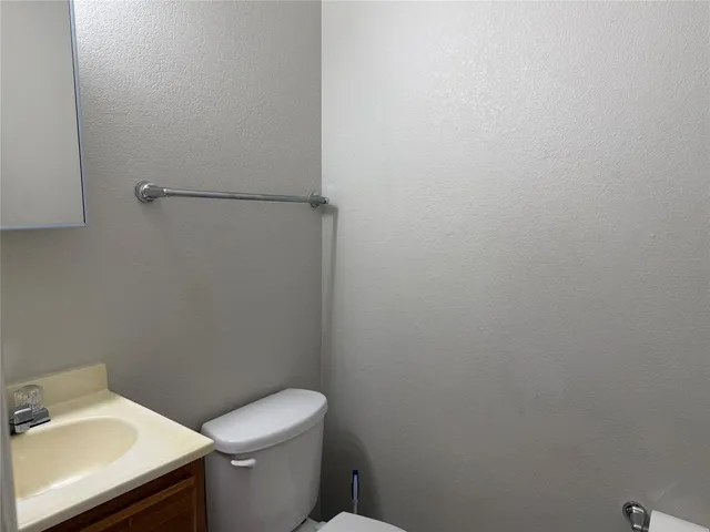 a bathroom with a sink and a toilet
