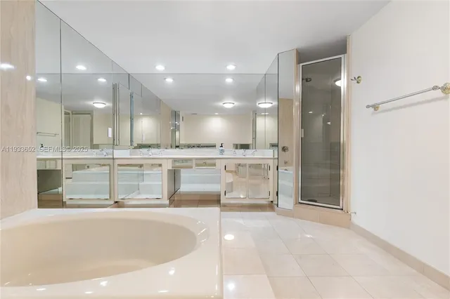 a view of a bathroom with a tub and sink