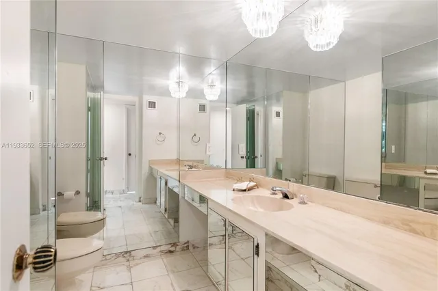 a view of a kitchen with a sink and dishwasher