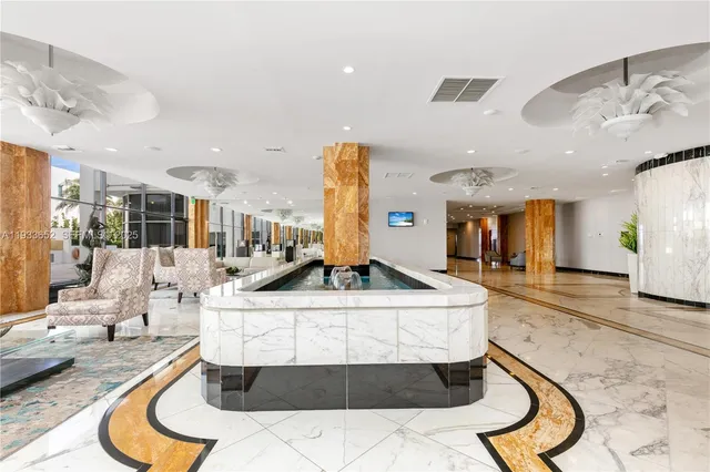 a view of lawn chairs under an umbrella