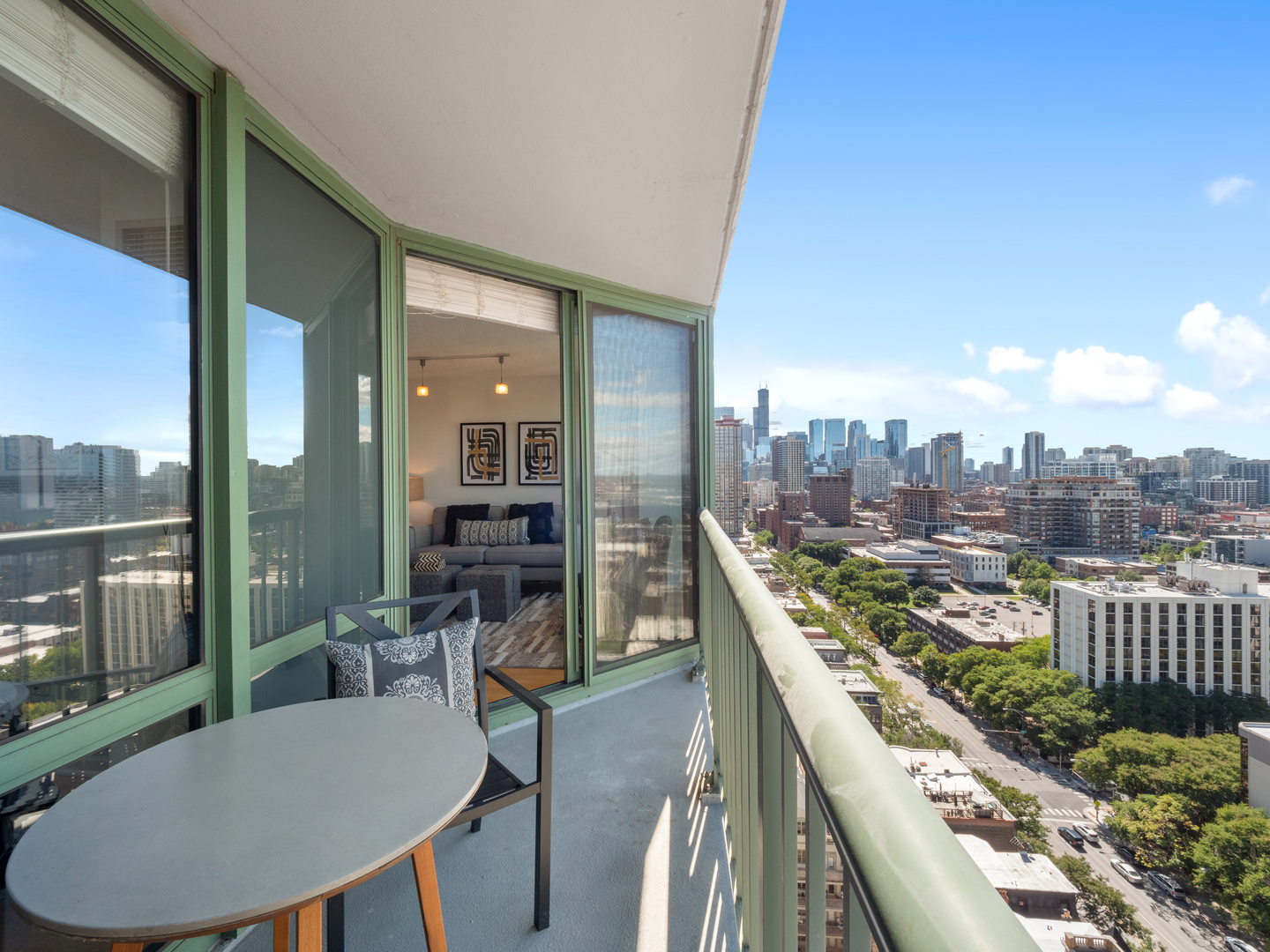 111 West Maple Street, Unit 2010 Chicago, IL 60610 - Photo 12 of 20 a view of a balcony dining table and chairs
