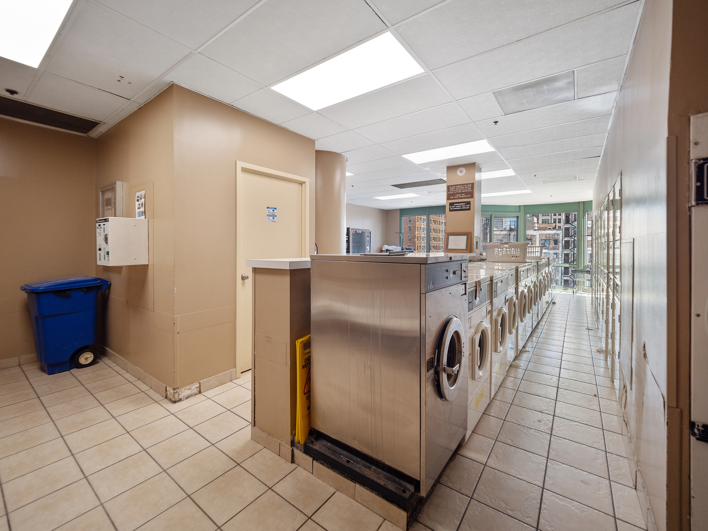 111 West Maple Street, Unit 2010 Chicago, IL 60610 - Photo 18 of 20 a kitchen with stainless steel appliances granite countertop a refrigerator and a sink