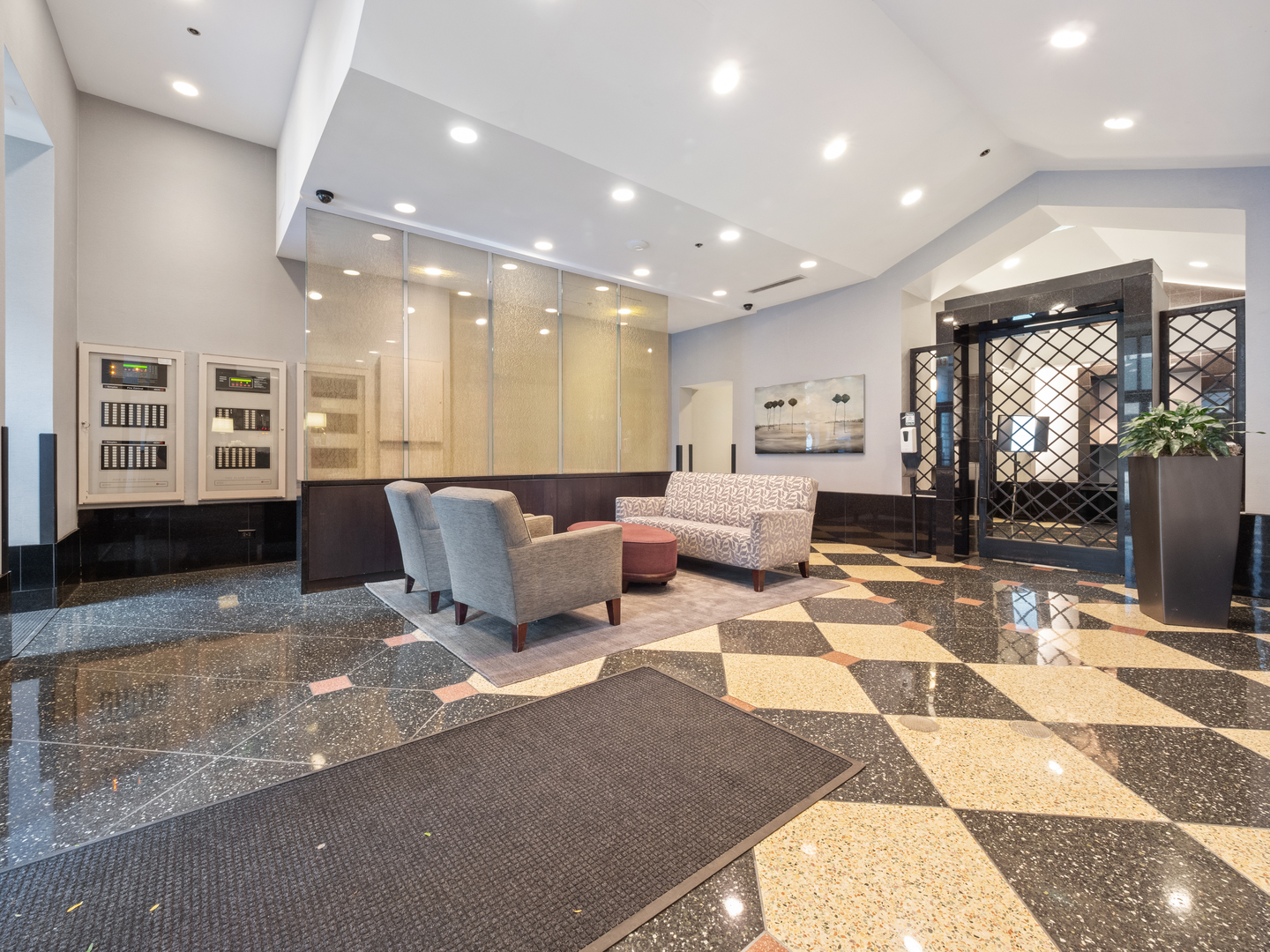 111 West Maple Street, Unit 2010 Chicago, IL 60610 - Photo 19 of 20 a living room with furniture and a rug