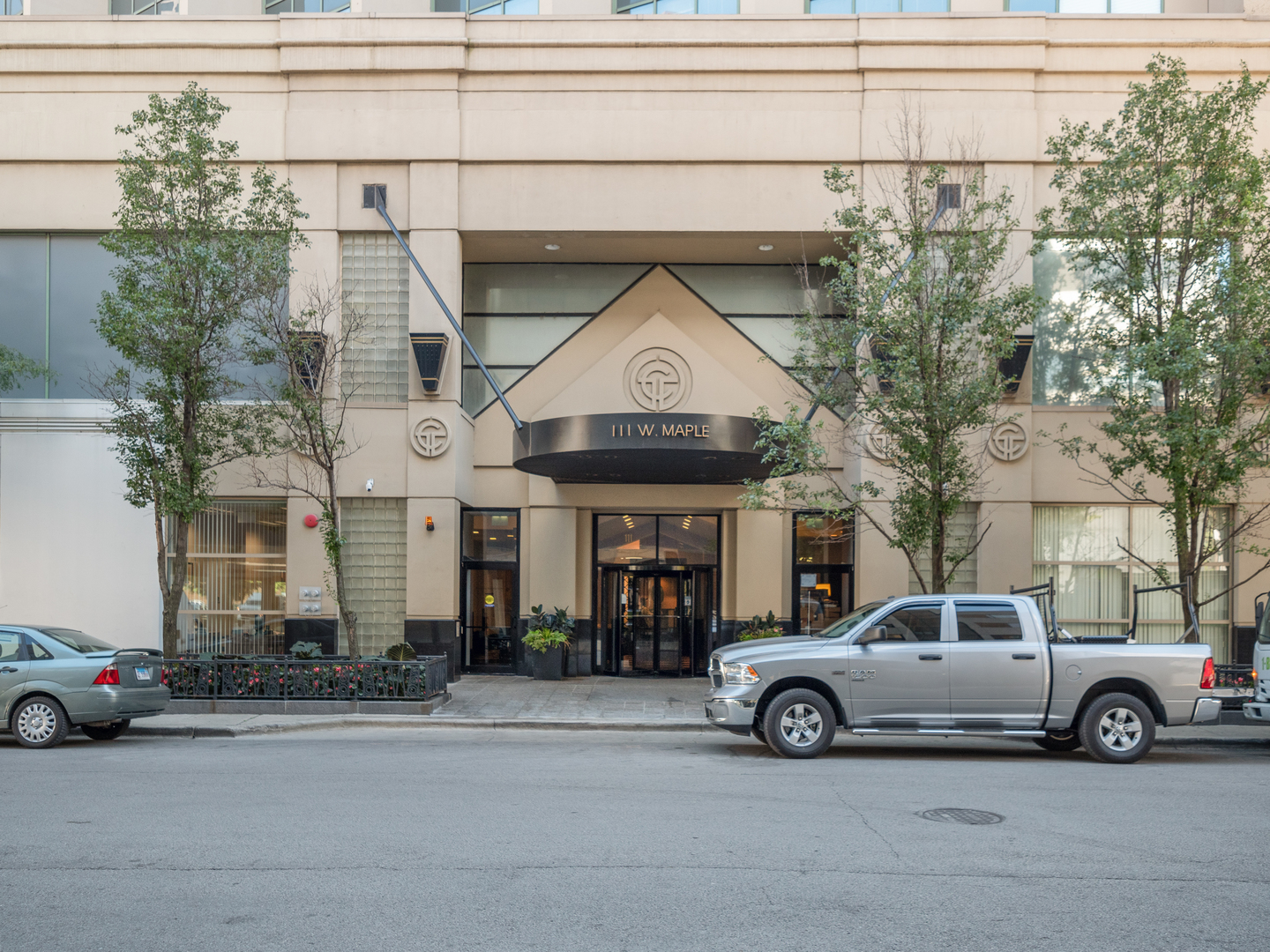 111 West Maple Street, Unit 2010 Chicago, IL 60610 - Photo 3 of 20 a car parked in front of a house