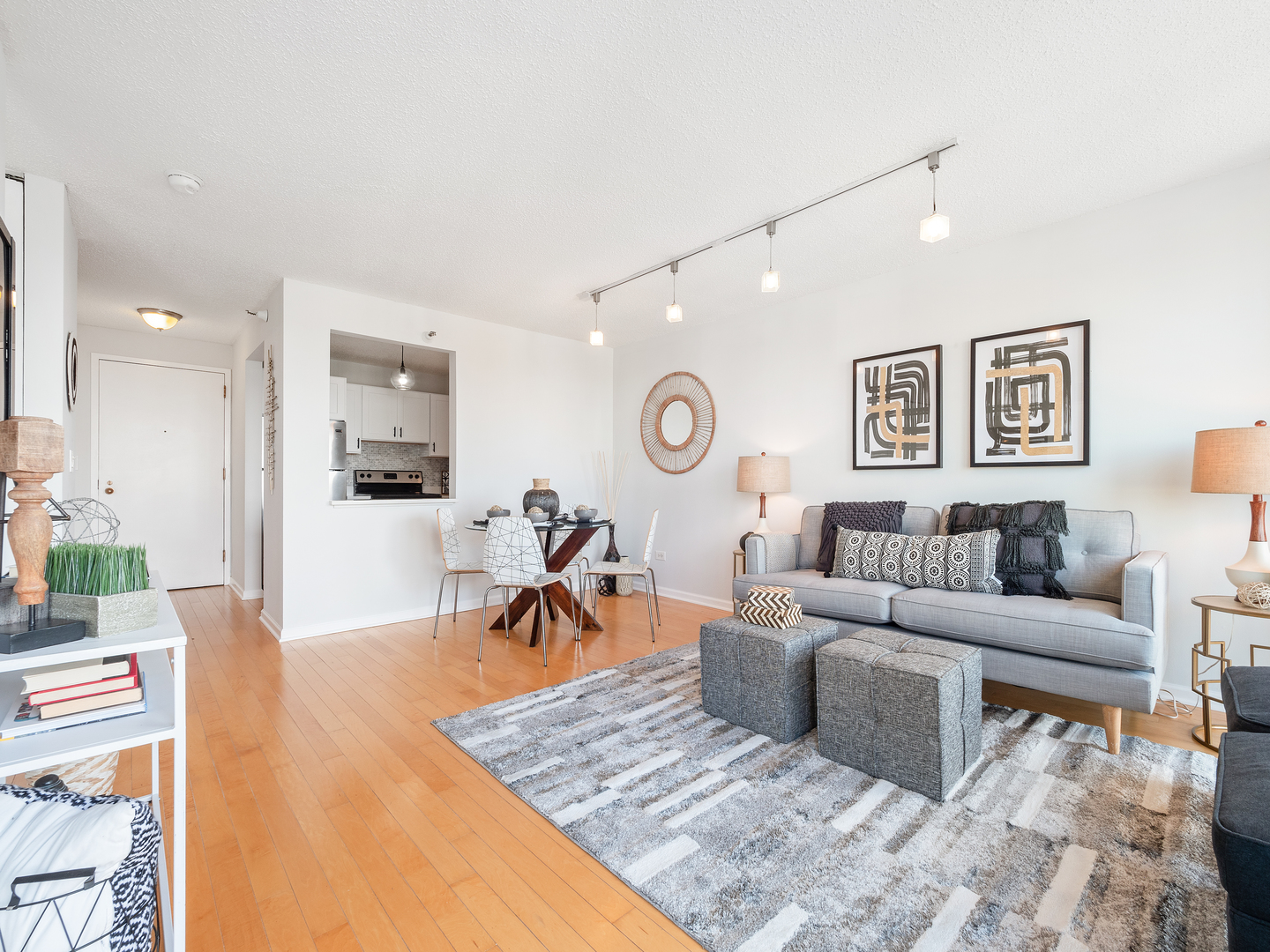 111 West Maple Street, Unit 2010 Chicago, IL 60610 - Photo 6 of 20 a living room with furniture and view of kitchen