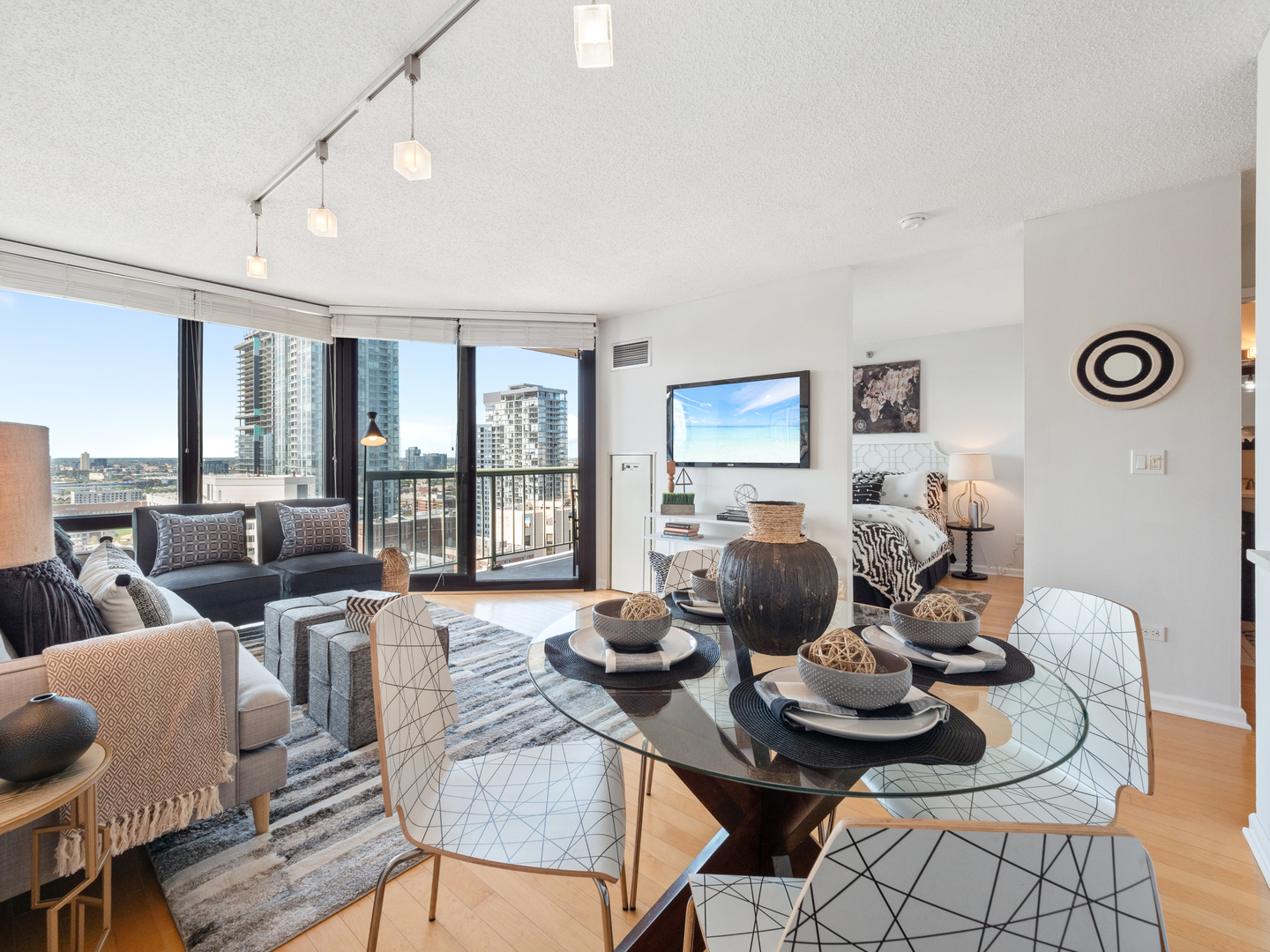 111 West Maple Street, Unit 2010 Chicago, IL 60610 - Photo 7 of 20 a living room with furniture and wooden floor