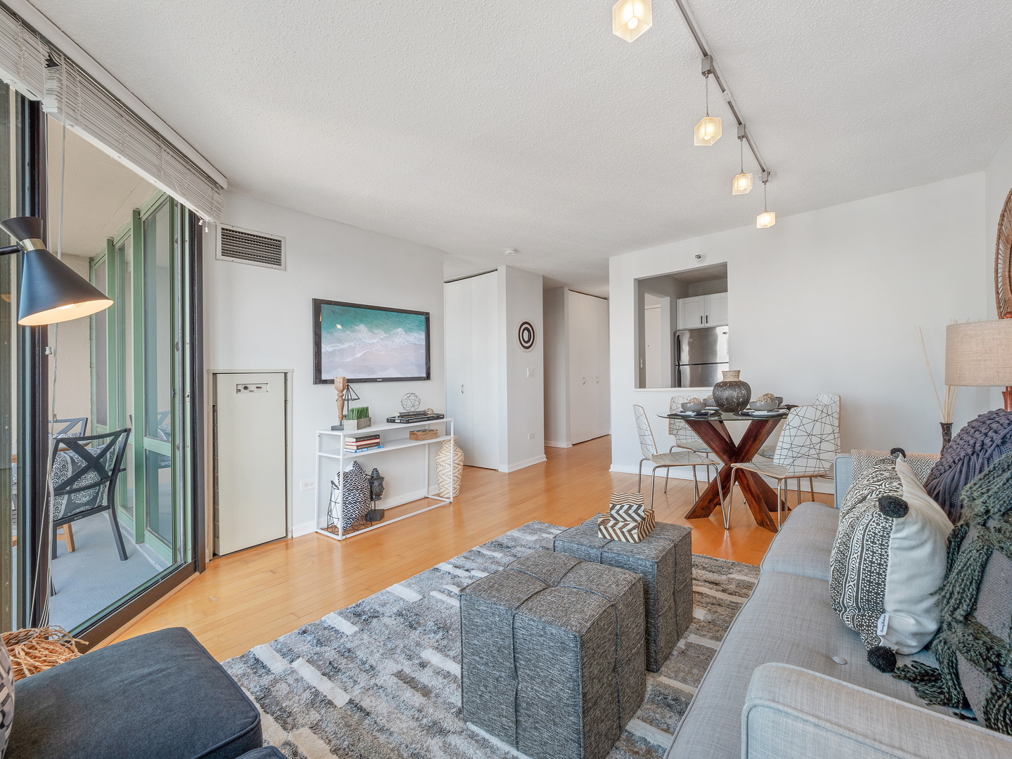 111 West Maple Street, Unit 2010 Chicago, IL 60610 - Photo 8 of 20 a living room with furniture and a flat screen tv
