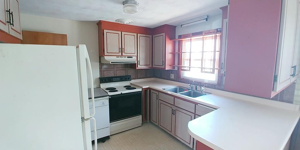 28 Intervale Road Springfield, MA 01118 - Photo 7 of 12 a kitchen with stainless steel appliances granite countertop a sink stove and refrigerator