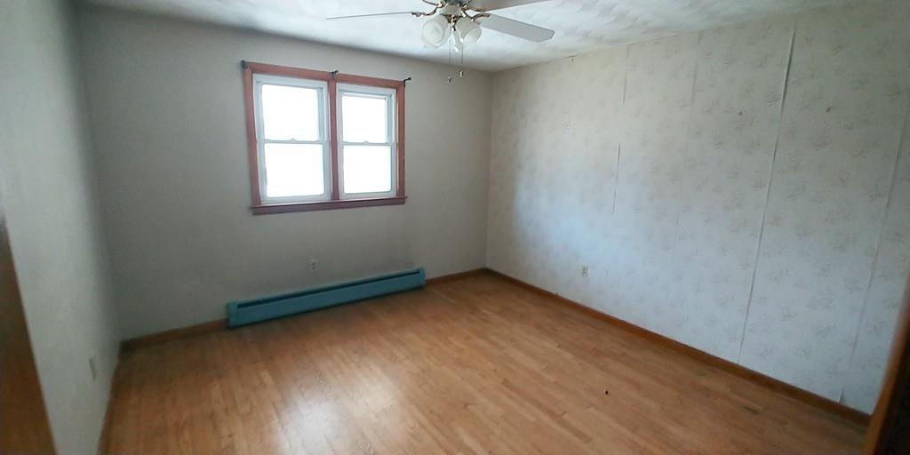 28 Intervale Road Springfield, MA 01118 - Photo 9 of 12 an empty room with a window and a chandelier fan