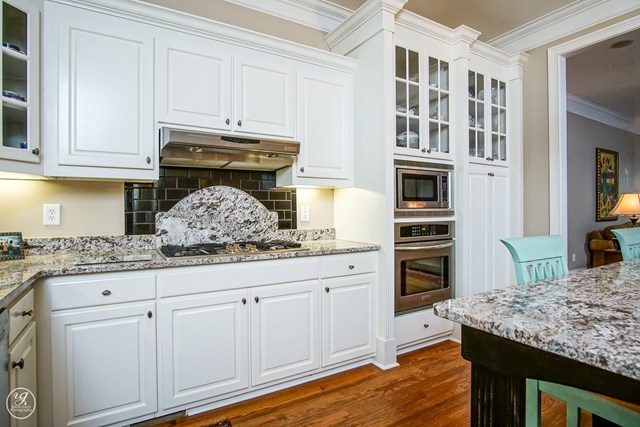 6620 Colaparchee Road Macon, GA 31210 - Photo 18 of 45 a kitchen with granite countertop a sink and cabinets