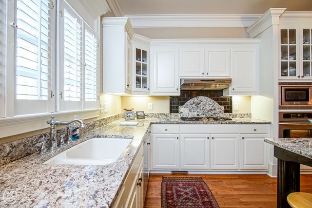 6620 Colaparchee Road Macon, GA 31210 - Photo 20 of 45 a kitchen with granite countertop a sink stove and cabinets