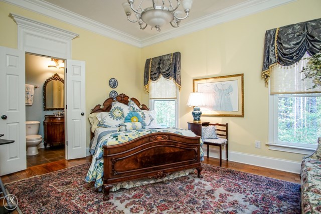 6620 Colaparchee Road Macon, GA 31210 - Photo 24 of 45 a bedroom with a bed and wooden floor