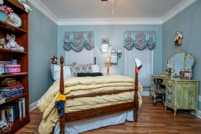 6620 Colaparchee Road Macon, GA 31210 - Photo 30 of 45 a bedroom with a bed and wooden floor