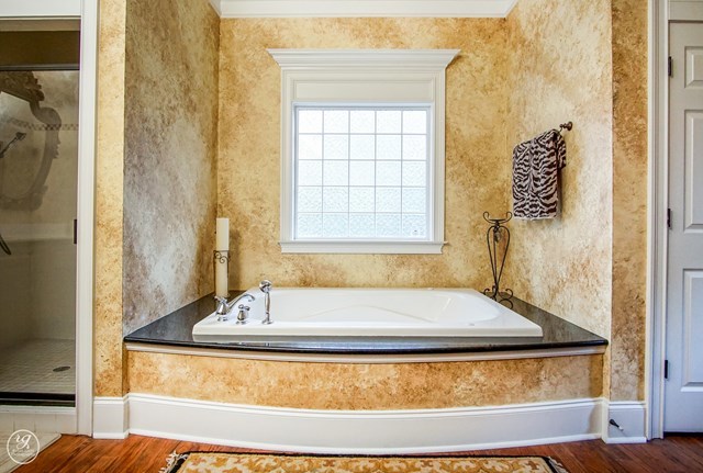 6620 Colaparchee Road Macon, GA 31210 - Photo 38 of 45 a bathroom with bathtub and window