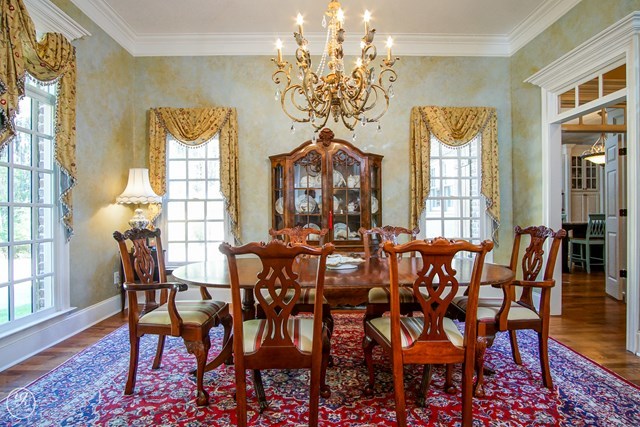 6620 Colaparchee Road Macon, GA 31210 - Photo 8 of 45 a view of a dining room with furniture wooden floor and chandelier