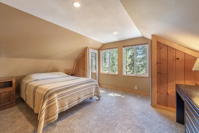 a view of a room with wooden floor and windows