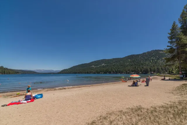 a view of a town with mountains in the background