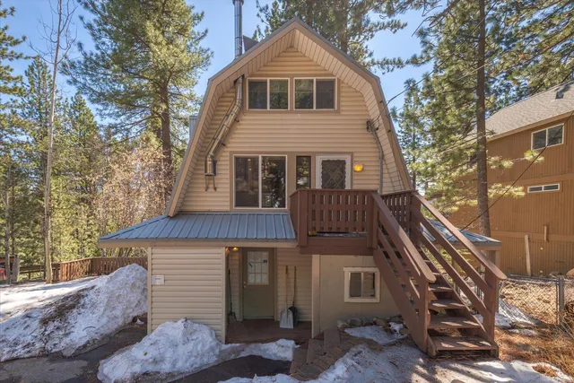 a view of a chairs and table in backyard